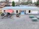 Exterior view of a large recreational building with picnic tables and a grill at 171 Holly Harbor Trl # B62, Mount Gilead, NC 27306