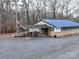 Exterior of a recreational building with covered seating and landscaping at 171 Holly Harbor Trl # B62, Mount Gilead, NC 27306