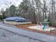 Exterior of building with playground including swings and a slide at 171 Holly Harbor Trl # B62, Mount Gilead, NC 27306