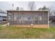 Charming screened porch with wood accents and welcoming lighting, perfect for relaxing outdoors at 171 Holly Harbor Trl # B62, Mount Gilead, NC 27306