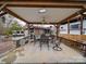 Covered outdoor patio area featuring a dining table, chairs, and a built-in bar at 171 Holly Harbor Trl # B62, Mount Gilead, NC 27306