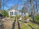 Outdoor firepit area in a lush backyard with seating, perfect for entertaining and relaxation at 1906 Overhill Dr, Monroe, NC 28110