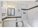 Modern bathroom with white marble tile and a black tile accent with a shower-tub combination at 1906 Overhill Dr, Monroe, NC 28110