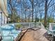 Relaxing outdoor deck area with comfortable seating and a picturesque view of the backyard at 1906 Overhill Dr, Monroe, NC 28110