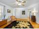 Bright living room with hardwood floors, and a view of a foyer, hallway, and a dark floral rug, and large arm chair at 1906 Overhill Dr, Monroe, NC 28110