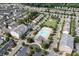 An aerial view of a neighborhood featuring a community pool, a playground and apartment homes at 1915 Colony Line Ct, Charlotte, NC 28210