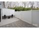 Private patio with white fence offering an ideal space for outdoor relaxation at 1915 Colony Line Ct, Charlotte, NC 28210