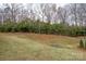 Expansive lawn with mature trees adding natural beauty to the property at 1915 Colony Line Ct, Charlotte, NC 28210