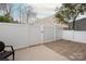 Private patio with white fence offering an ideal space for outdoor relaxation at 1915 Colony Line Ct, Charlotte, NC 28210