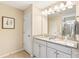 Bright bathroom with double vanity, granite countertop, and updated fixtures at 1915 Colony Line Ct, Charlotte, NC 28210