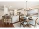 Open-concept dining area next to the kitchen with granite counters and a breakfast bar, creating an inviting space at 1915 Colony Line Ct, Charlotte, NC 28210