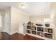 Upstairs hallway featuring built-in bookshelves, hardwood floors, and neutral paint for a cozy, inviting space at 1915 Colony Line Ct, Charlotte, NC 28210