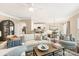 Bright and airy living room featuring a ceiling fan, hardwood floors, and neutral-toned furniture at 1915 Colony Line Ct, Charlotte, NC 28210