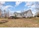 Backyard shot shows deck, back of house, and side yard at 207 Cypress Dr, Gastonia, NC 28052