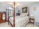 Bedroom showcasing a four-poster bed, ceiling fan, and large window providing plenty of natural light at 207 Cypress Dr, Gastonia, NC 28052