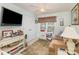 Bedroom features a ceiling fan and a window that allows natural light to illuminate the room at 207 Cypress Dr, Gastonia, NC 28052