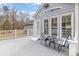 Back deck with table, chairs, and accent pillows at 207 Cypress Dr, Gastonia, NC 28052