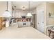 Bright kitchen with white cabinetry, stainless steel appliances, and a tile backsplash at 207 Cypress Dr, Gastonia, NC 28052