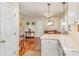 Inviting living room featuring hardwood floors and light neutral paint, with a view into the kitchen area at 207 Cypress Dr, Gastonia, NC 28052