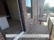 Rear balcony off kitchen, with a wooden deck and black metal railing at 214 Gilead Rd, Huntersville, NC 28078