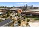 A vibrant aerial view of Camp North End featuring rooftops, greenery, and the Charlotte skyline at 2223 Edison St, Charlotte, NC 28206