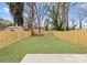 Spacious backyard featuring newly installed wooden fencing and fresh sod at 2223 Edison St, Charlotte, NC 28206
