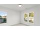 Bright, empty bedroom with natural light from two large windows and a soft carpeted floor at 2223 Edison St, Charlotte, NC 28206