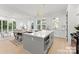 Bright, modern kitchen features a large island, white cabinets, and an open floor plan to the living area at 2223 Edison St, Charlotte, NC 28206