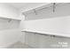 Well-organized walk-in closet featuring built-in shelving for optimal storage and organization at 2223 Edison St, Charlotte, NC 28206