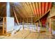 Spacious unfinished attic area showcasing exposed rafters and insulation at 2227 Cashmere Ct, Denver, NC 28037
