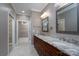Bathroom with granite countertop, a double sink vanity and mirrors, and large closet at 2227 Cashmere Ct, Denver, NC 28037