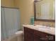 This bathroom includes a vanity with granite counters, a toilet, and a bathtub with shower at 2227 Cashmere Ct, Denver, NC 28037