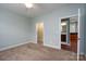 Bedroom featuring neutral walls and carpet floors, plus entry into bathroom and closet at 2227 Cashmere Ct, Denver, NC 28037
