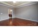 Spacious bedroom with hardwood floors, trey ceilings, and bathroom access at 2227 Cashmere Ct, Denver, NC 28037