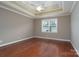 Spacious bedroom featuring trey ceilings, hardwood floors, and a ceiling fan at 2227 Cashmere Ct, Denver, NC 28037