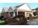 Inviting single-story brick home with manicured landscaping and a welcoming front porch at 2227 Cashmere Ct, Denver, NC 28037