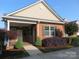 Charming brick home with a covered porch, complemented by mature landscaping and inviting curb appeal at 2227 Cashmere Ct, Denver, NC 28037