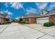 Charming brick home with attached garage and well-manicured landscaping at 2227 Cashmere Ct, Denver, NC 28037