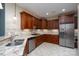 A kitchen featuring wooden cabinets, stone countertops, and stainless steel appliances at 2227 Cashmere Ct, Denver, NC 28037