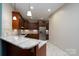 A kitchen featuring granite countertops and a stainless steel refrigerator at 2227 Cashmere Ct, Denver, NC 28037