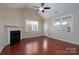 Bright living room featuring hardwood floors, fireplace, and natural light at 2227 Cashmere Ct, Denver, NC 28037