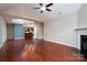 Spacious living room with hardwood floors, fireplace, and views of the kitchen at 2227 Cashmere Ct, Denver, NC 28037