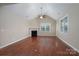 Living room featuring hardwood floors, fireplace, and large windows at 2227 Cashmere Ct, Denver, NC 28037
