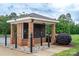 Brick mailbox pavilion with black mailboxes, featuring manicured landscaping at 2227 Cashmere Ct, Denver, NC 28037