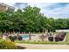 A communal swimming pool surrounded by lounge chairs and lush landscaping at 2227 Cashmere Ct, Denver, NC 28037