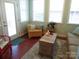 Bright sunroom with wicker furniture, a wooden chest, and many windows at 2227 Cashmere Ct, Denver, NC 28037