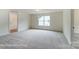 Large bedroom with neutral carpet, walk-in closet, and natural light from the window at 2228 Tabor Rd # 569, Sherrills Ford, NC 28673