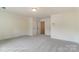 Large, light-filled bedroom with neutral carpet and a walk-in closet at 2228 Tabor Rd # 569, Sherrills Ford, NC 28673