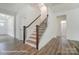 Bright foyer with hardwood floors, staircase with wood railing, and white trim at 2228 Tabor Rd # 569, Sherrills Ford, NC 28673