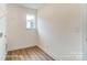 Well-lit laundry room with hardwood flooring and a window providing natural light at 2228 Tabor Rd # 569, Sherrills Ford, NC 28673